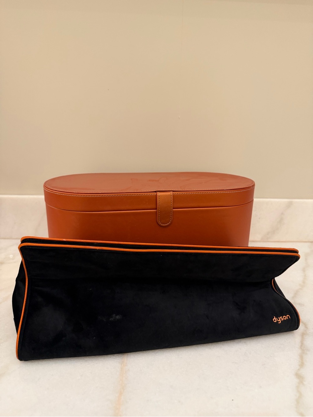 Dyson Black Pouch with Orange Trim and Tan Oval Case